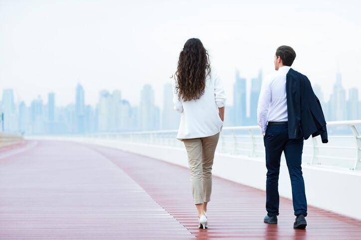 Couple walking back to their office after a break.