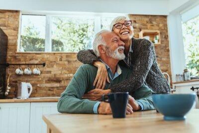 Shot of a mature woman hugging her husband, happy couple