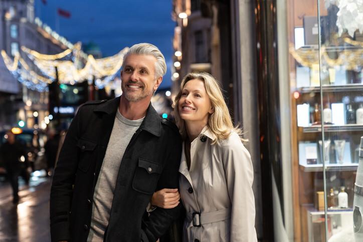 Happy couple shopping n and smiling