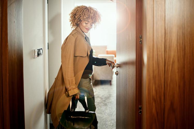 Businesswoman entering the hotel room