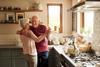 Cropped shot of a senior couple dancing in the kitchen at home