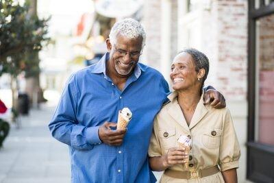 A senior african american couple enjoy an date on the town with ice cream