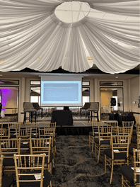 Image of stage and seating set up for a Maclynn talk on 5 Steps to Relationship Success