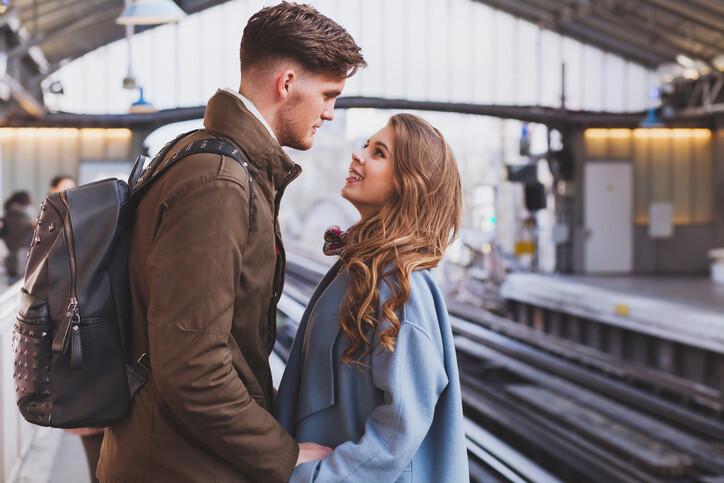 long distance relationship, couple on platform at the train station, meeting or parting concept
